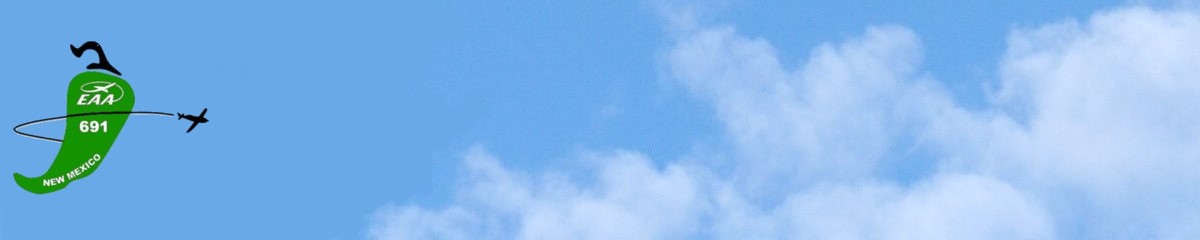 airplane flying around a green chile pepper in a blue sky with clouds